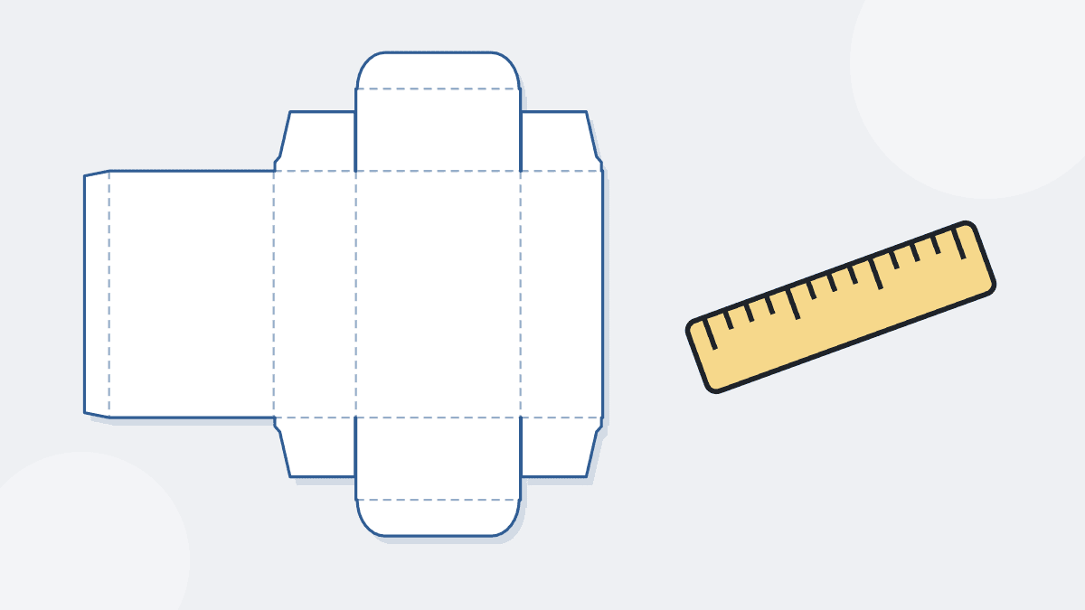 A flat box pattern with a ruler, for measuring box dimensions