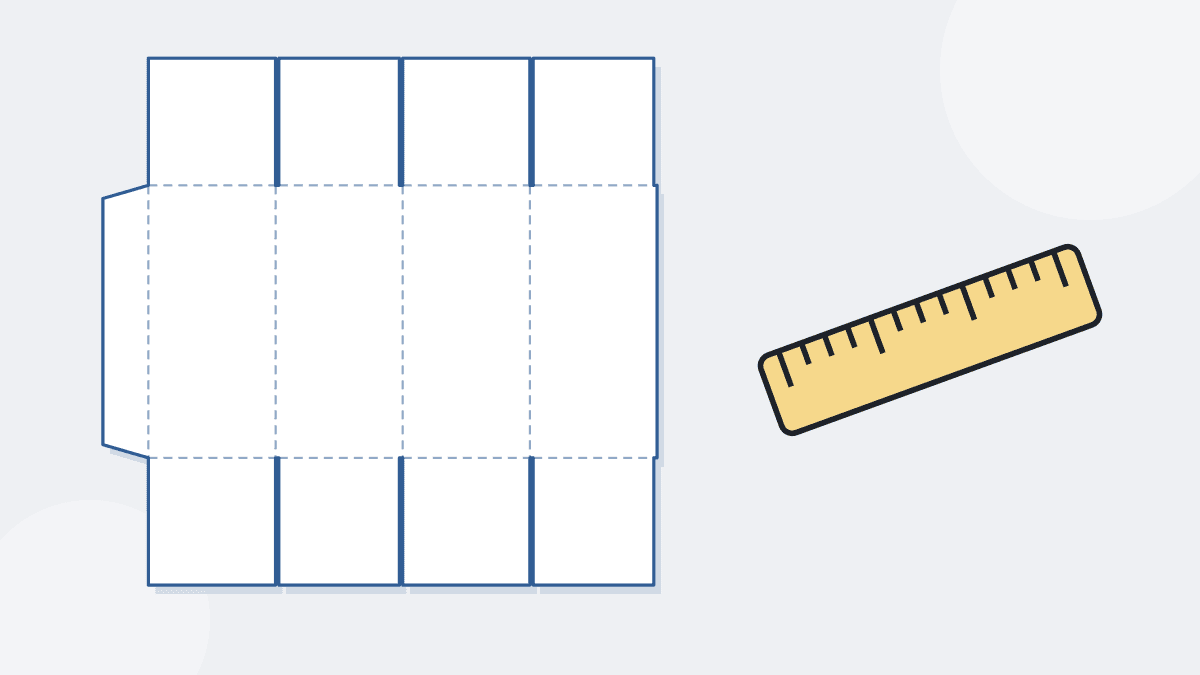 A flat large cardboard box pattern with a ruler