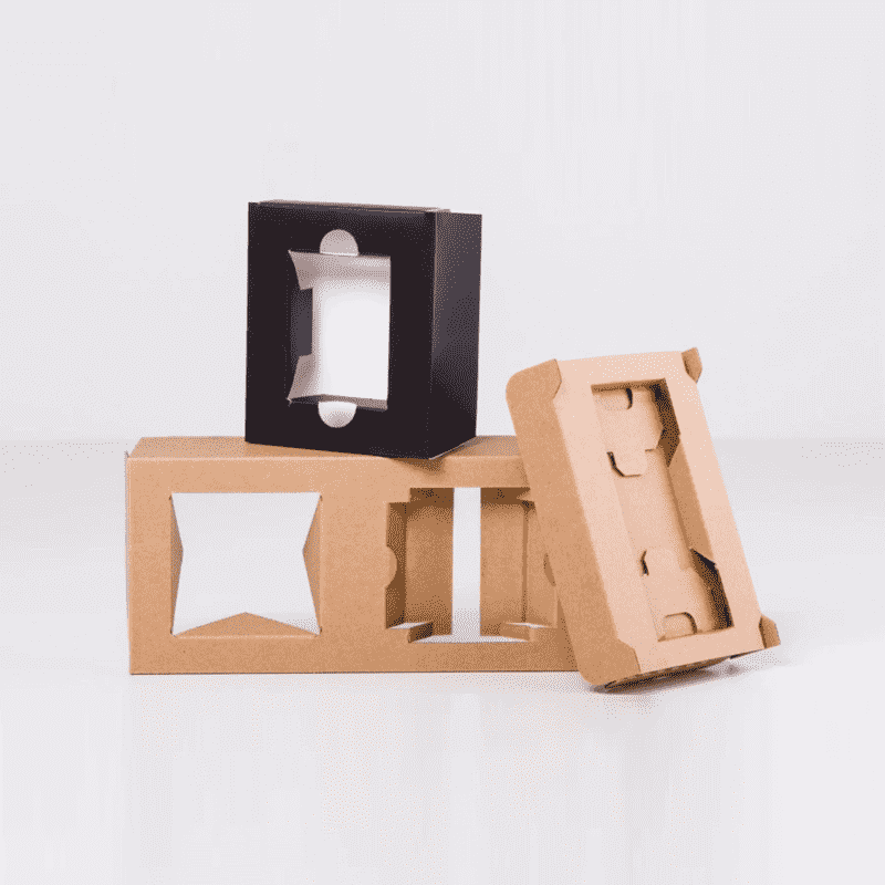 Custom cardboard box inserts with cut-out openings in brown kraft and black board